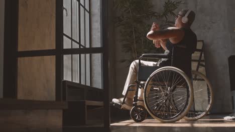 woman in wheelchair enjoying music