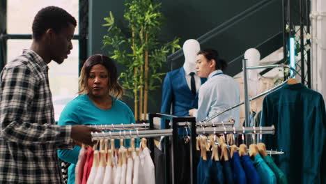 worker helping cheerful couple