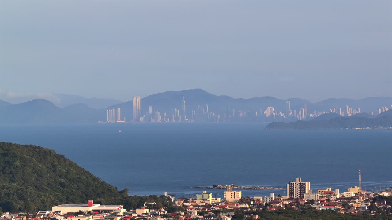 Distant view of Balneário Camboriú skyline from Armação Beach and Navegantes in Santa Catarina, Brazil