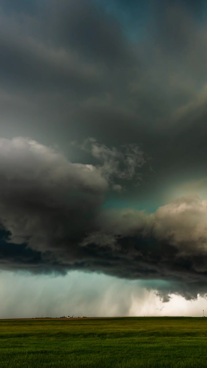 Dark thunderstorm clouds rolling overhead in a dramatic weather sky scene