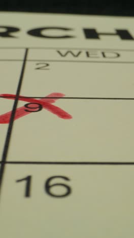 calendar pages with dates marked and crossed out