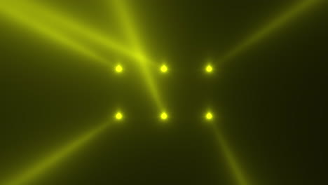 Yellow-glowing-spotlight-beams-on-black-gradient-stage