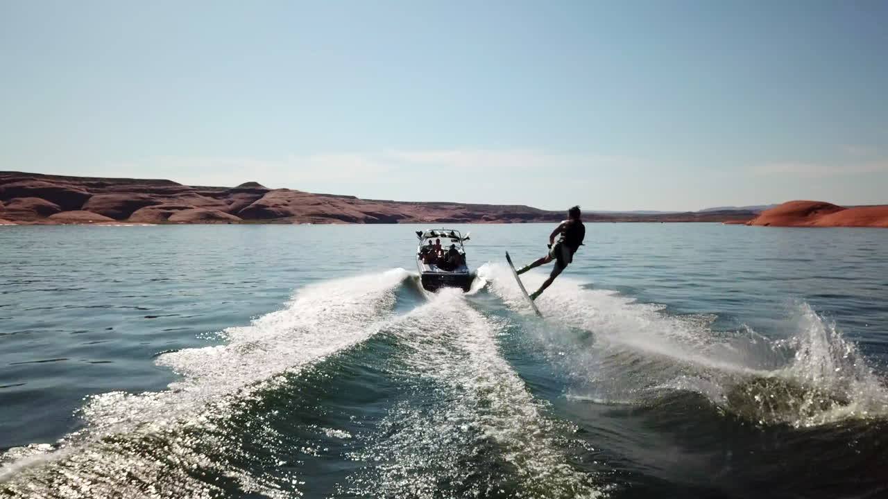 Drone shot of wakeboarding trick in Lake Powell Utah
