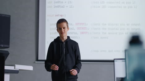teenager presenting a coding project