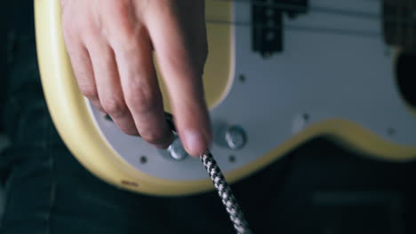 professional bassist checks quarter-inch jack wire