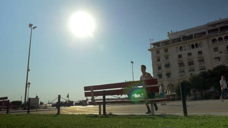 Parkour-Tracer-Young-Man-Making-Frontflip-over-the-Bench