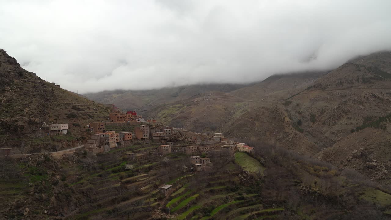 The peaceful village is set against snow-covered peaks of Toubkal, with wide gorges and sprawling hills creating an awe-inspiring scene in Morocco