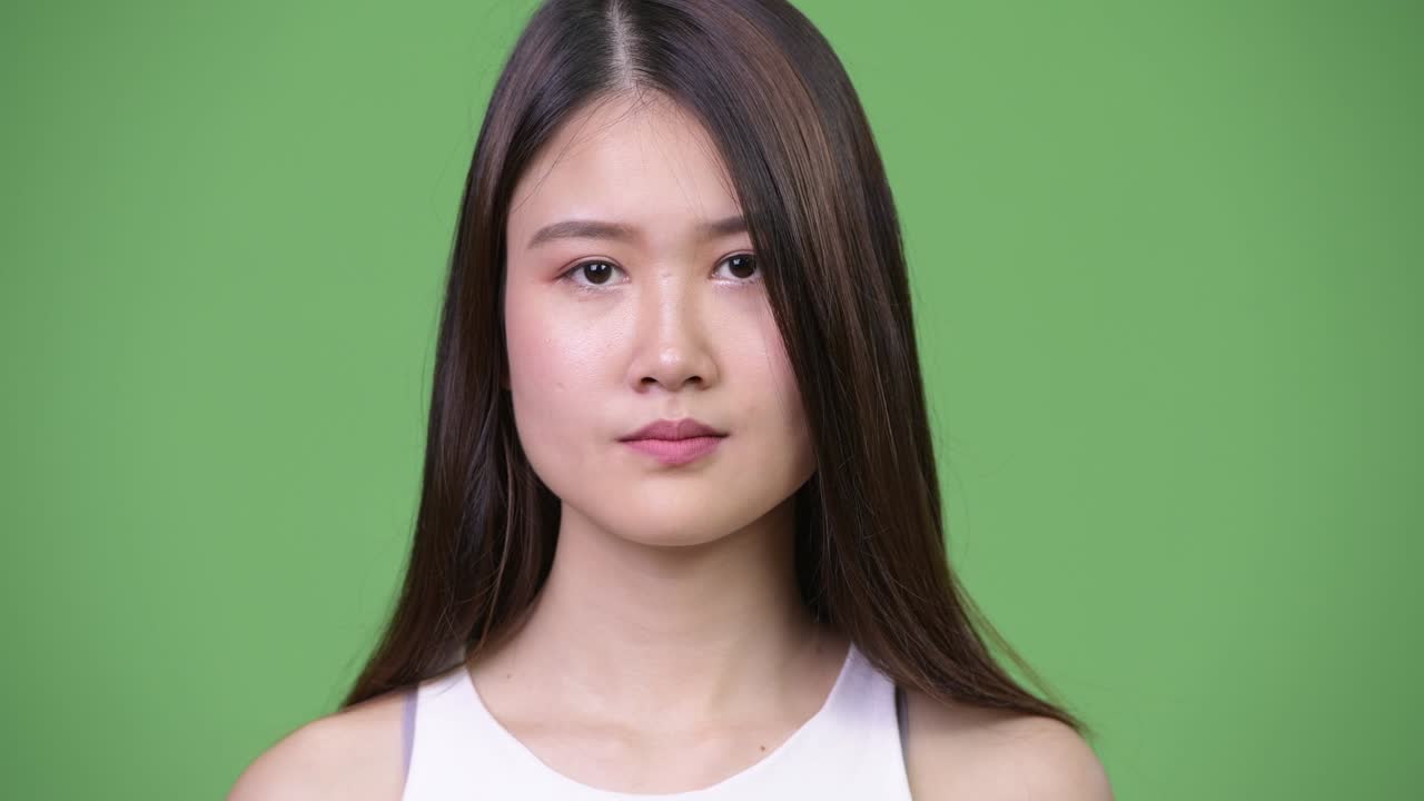 Young beautiful Asian businesswoman covering eyes as three wise monkeys concept