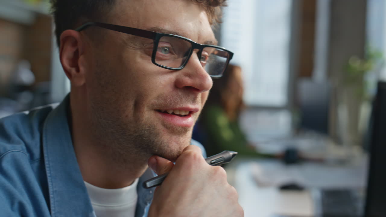 Designer hand drawing graphic tablet at corporate office closeup. Man working