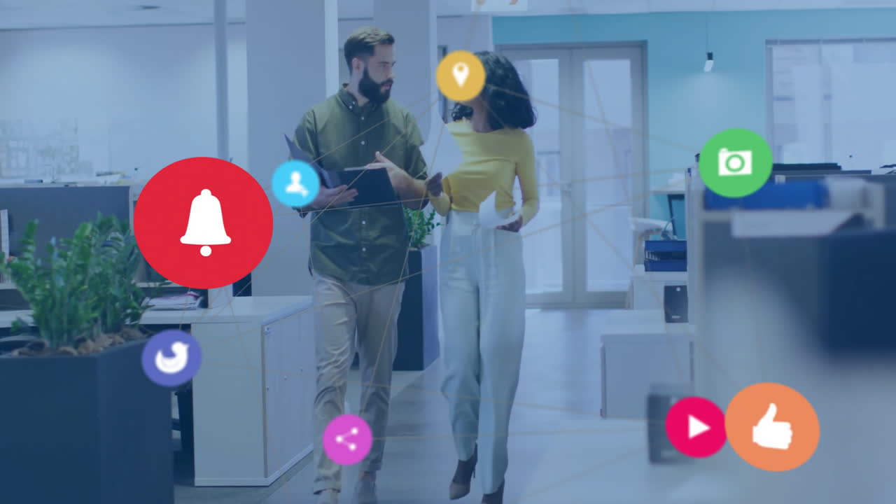 Business professionals walking in office with social media icons overlay animation