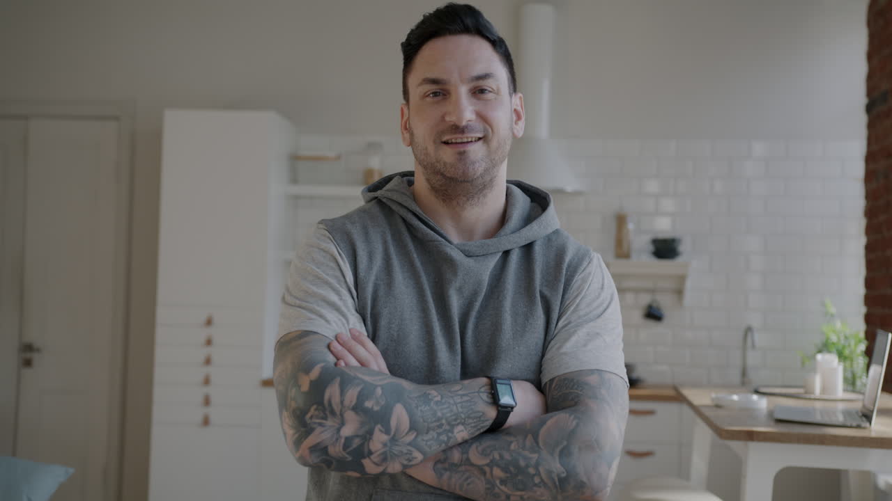 Man with Tattoos in a Kitchen