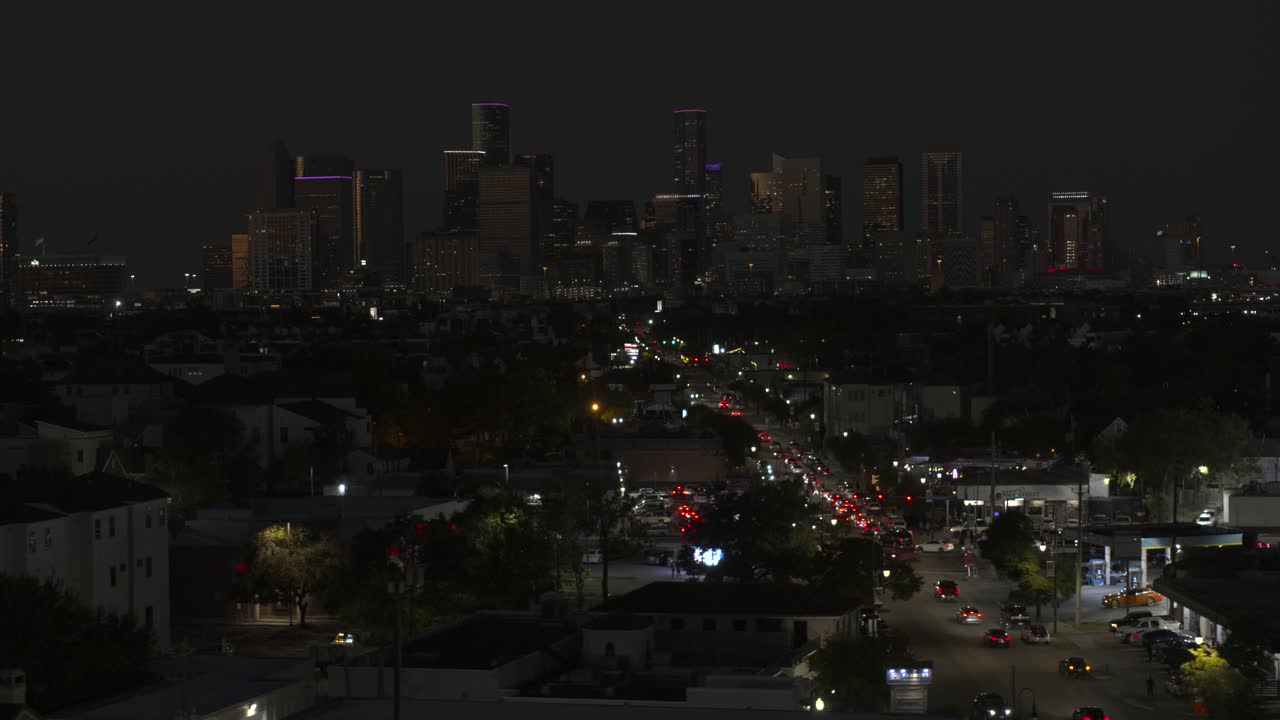 Establishing drone shot of downtown Houston and the 3rd Ward area at night