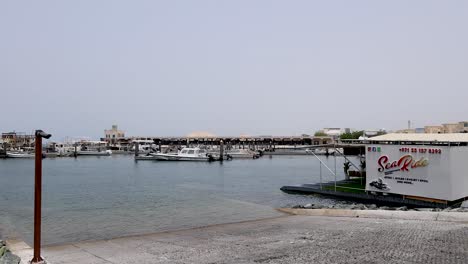 a boat docks at a marina in dubai