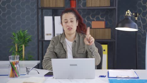 business woman nodding negative and negative to the camera.
