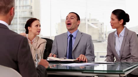 business people laughing during a job interview