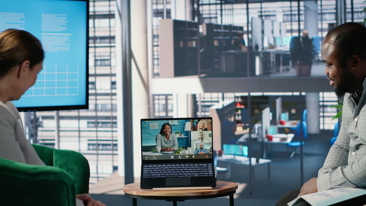 Vertical Video Multiethnic business leaders engaged in a web video conference in office lobby