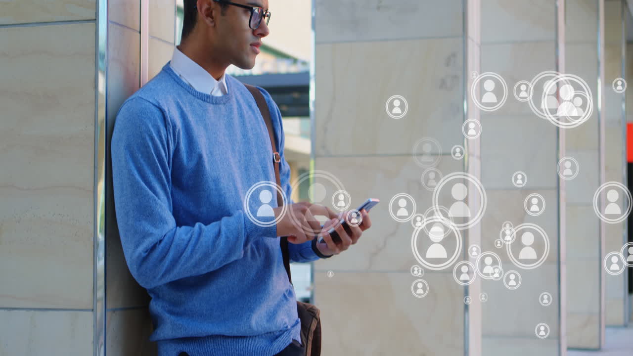 A young man using his mobile phone 4k