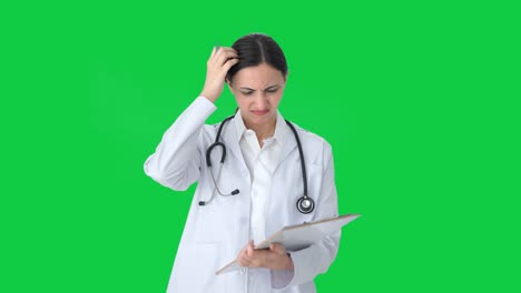 Confused-Indian-female-doctor-thinking-about-something-Green-screen