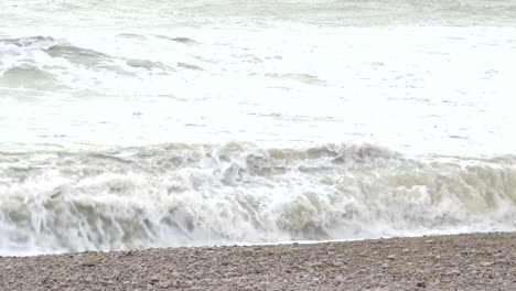 stormy ocean waves crashing on the beach