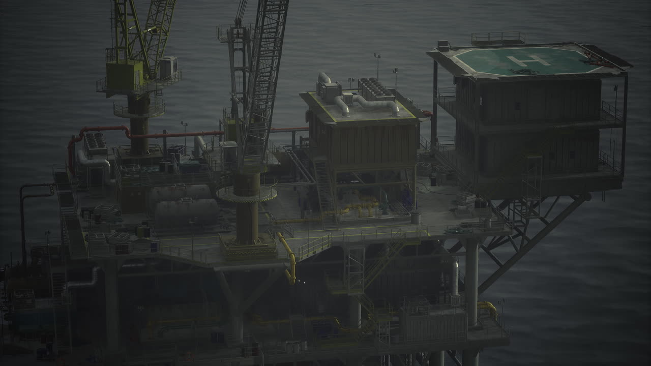 Oil rig operating offshore during late evening hours with lights visible