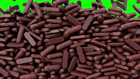 chocolates falling down from above and filling the screen. sweets green screen background pattern texture.