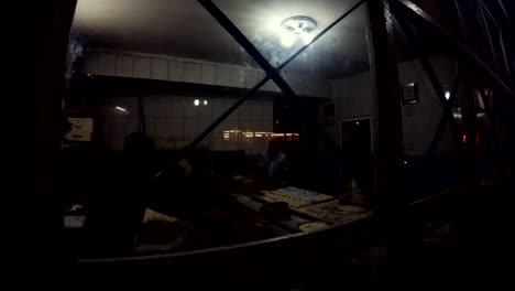 workers in small bakery evening old urfa view through bars on windows
