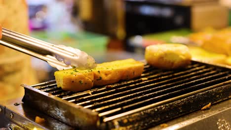 garlic bread being grilled