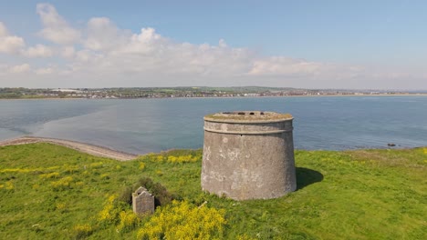 napoleonic era tower fort on grassy headland overlooking the sea coastal ireland
