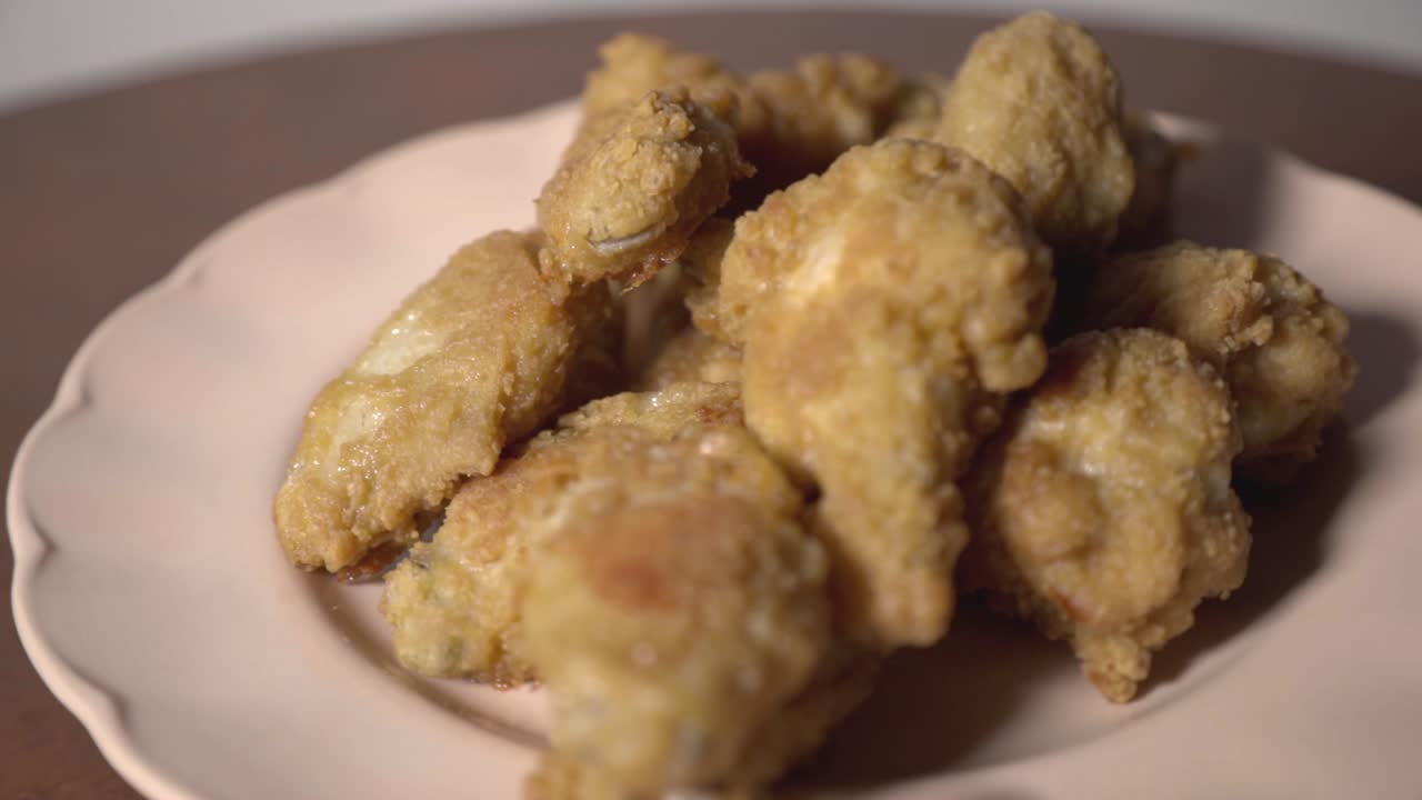 Delicious Crispy Fried Chicken Wings On White Plate - Closeup Shot