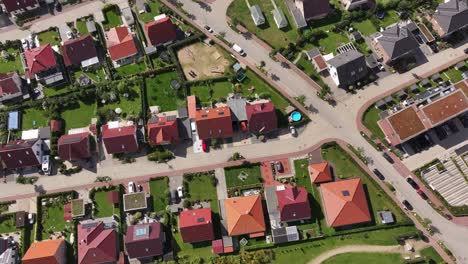 suburban residential area with single family houses with gardens in a small town, top down view