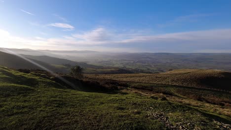 time lapse distant misty layers of panoramic rural mountain valley countryside at sunrise