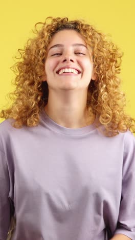 happy young woman with curly hair