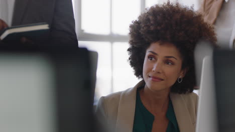 beautiful african american business woman taking notes in office meeting brainstorming ideas planning strategy