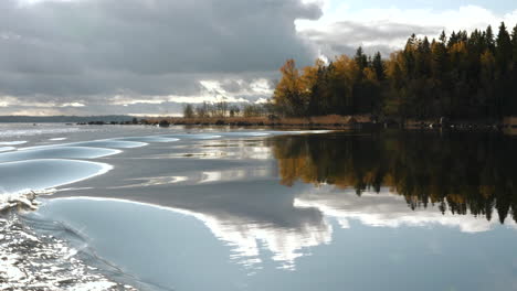 Amazing-autumn-scenery-and-calm-water-from-moving-boat-in-Kvarken-Archipelago,-Finland