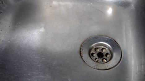 kitchen sink with water drop dripping, background loop