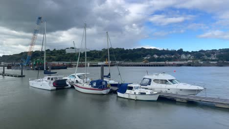 waterford city quays ireland timelapse boats moored construction on north quays in background strongly flowing river on summer day