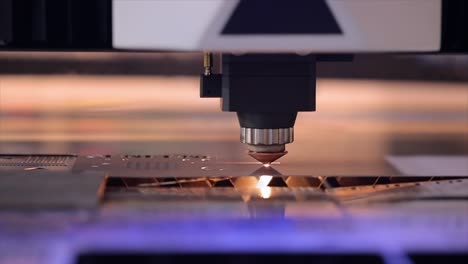 CNC-Laser-cutting-of-metal-in-slow-motion,-modern-industrial-technology.