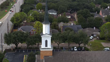 drone view of a church surrounding by homes in southwest houston, texas