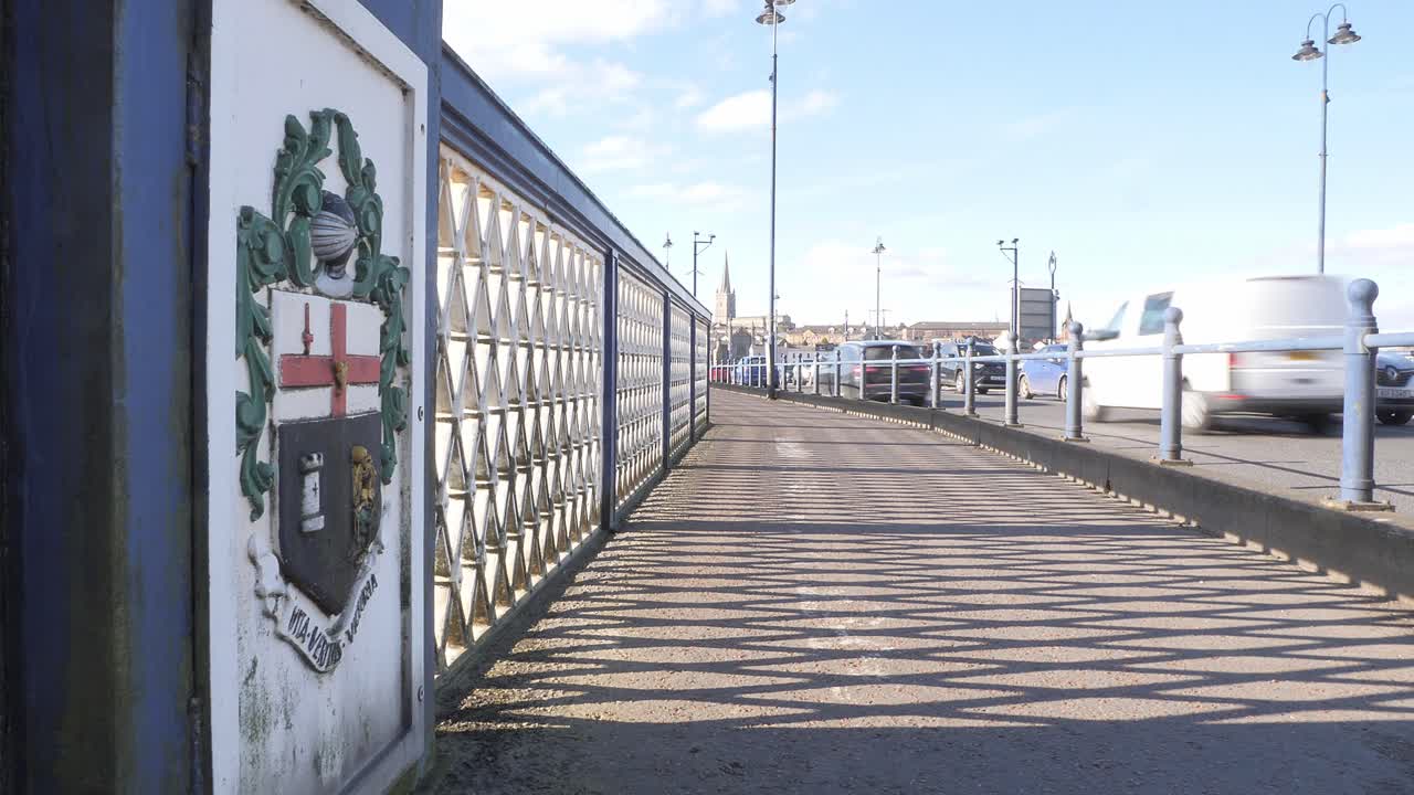 City Bridge with Coat of Arms and Passing Cars