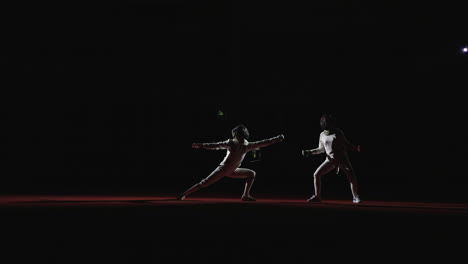 two fencers competing in a fencing match