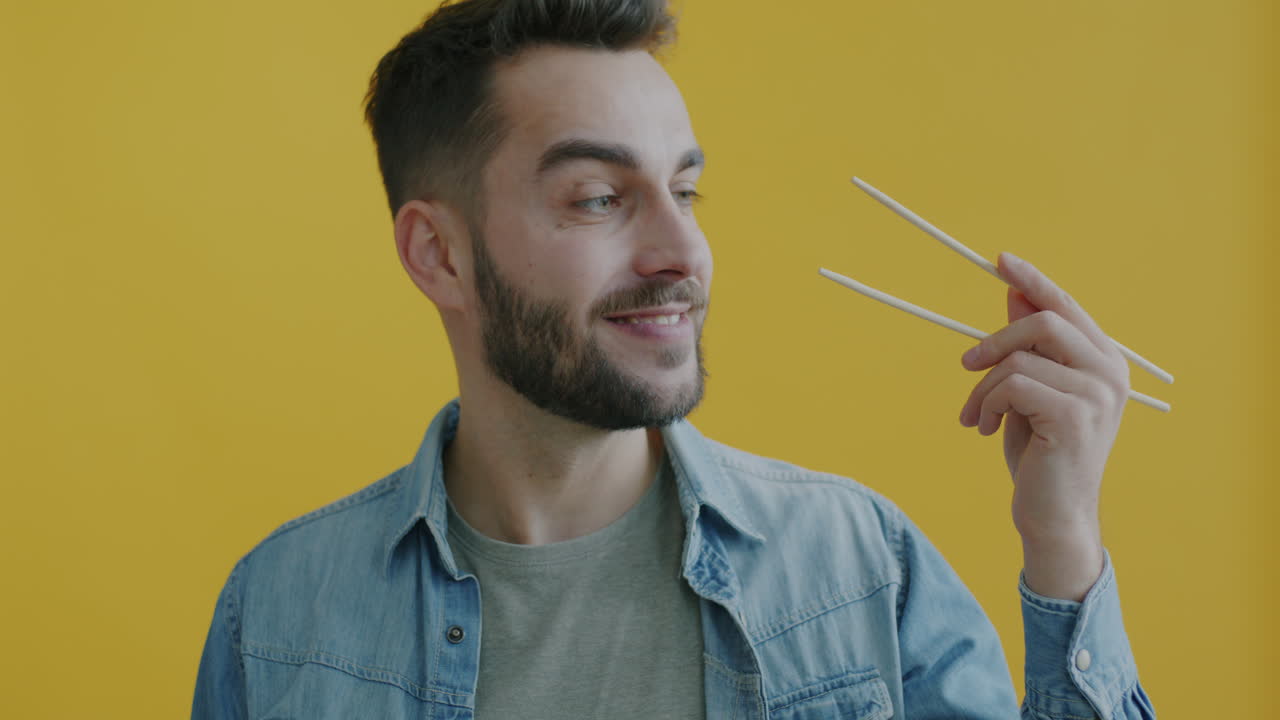 Man holding chopsticks