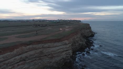 coastal cliff at sunrise/sunset