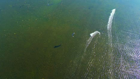 Aerial-of-Kite-surfing-at-the-famous-Punta-Trettu,-San-Giovanni-Suergiu,-South-Sardinia,-Italy