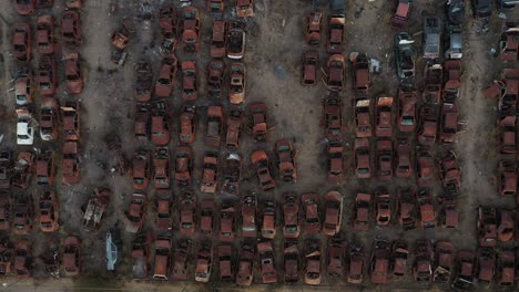 close up aerial cenital shot left to right from a abandonated car junk