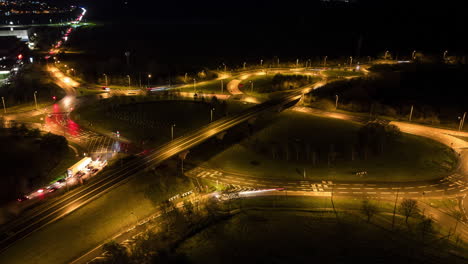 Aerial-Night-Hyperlapse-Motion-Time-Lapse-of-A47-Major-Road-and-Roundabout-with-Car-Light-Trails-in-King's-Lynn-Norfolk-UK