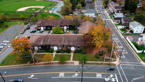 New-Brunswick-residential-drone-shot-American-flag-waving-in-air-orbital-shot-drone