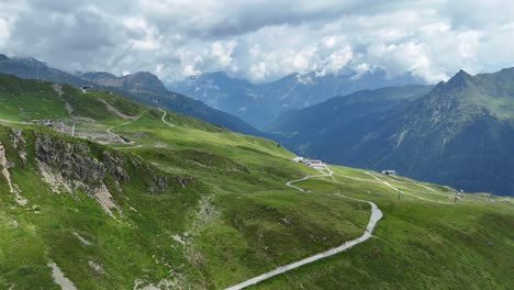 aerial view of hiker path in green mountains of austria