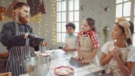 Chef-Teaching-Kids-How-to-Form-Dough-during-Cooking-Masterclass