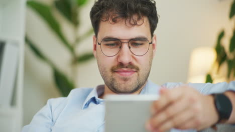 Close-Shot-of-Man-Working-and-Shopping-Online