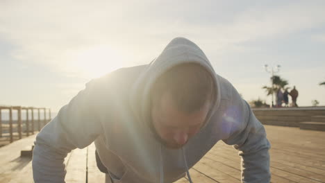 man doing push-ups outdoors